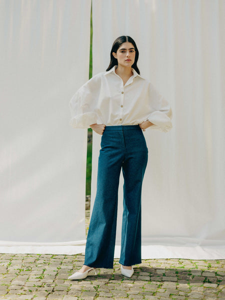 ASTRA: Flared legs, hook closure, handmade fringes. Sustainable, versatile, stylish. GOTS certified.