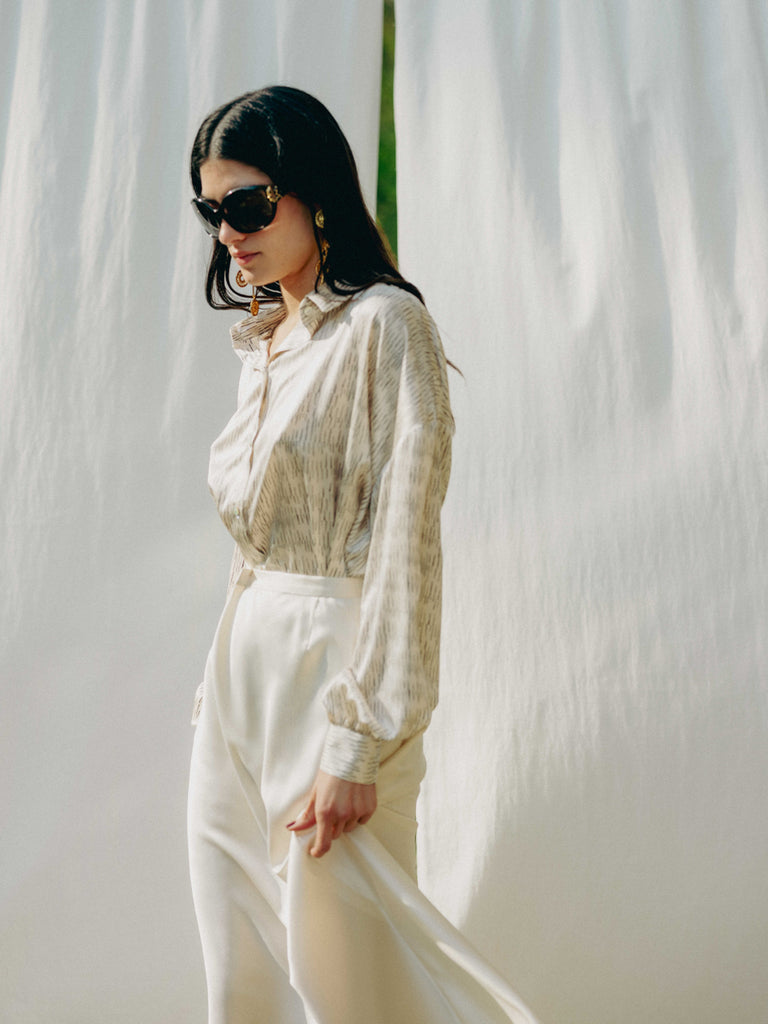 Elegant midi skirt from recycled PET bottles, silky feel, 70s style, hidden zipper, high-quality drape.