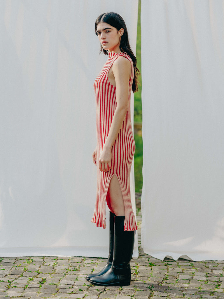 Swiss-made unique rib-knit cotton dress with pleated design, elegant high neckline, and chic side slits, perfect for evening wear or casual style, sustainable and made to order