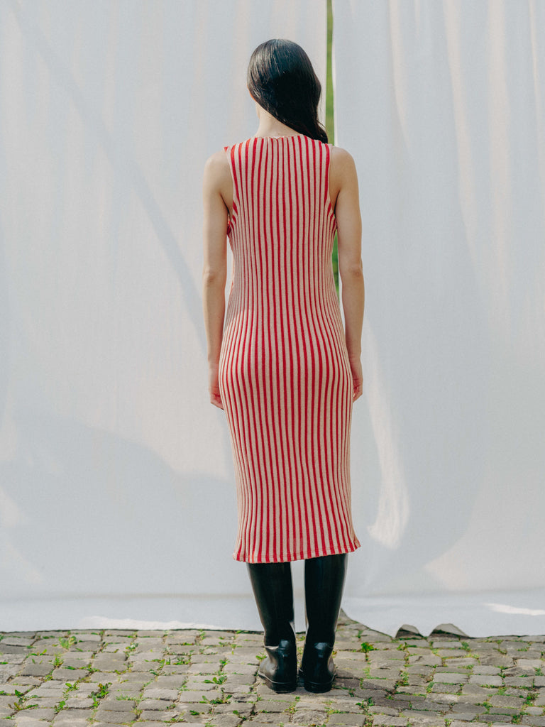 Swiss-made unique rib-knit cotton dress with pleated design, elegant high neckline, and chic side slits, perfect for evening wear or casual style, sustainable and made to order