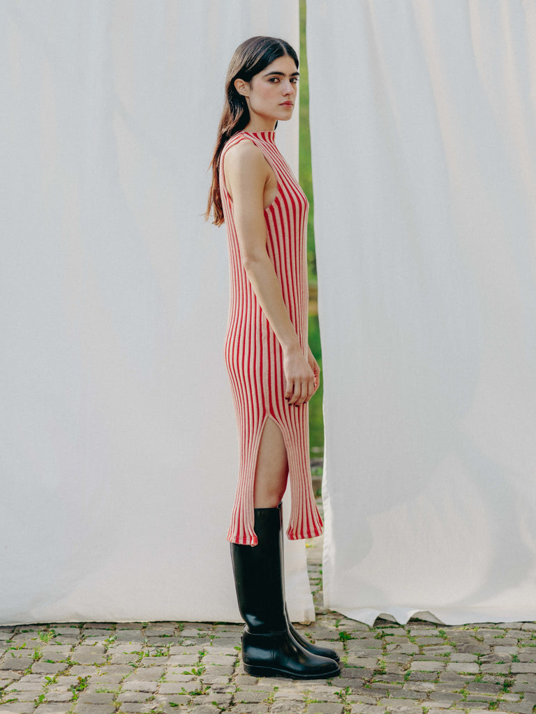 Swiss-made unique rib-knit cotton dress with pleated design, elegant high neckline, and chic side slits, perfect for evening wear or casual style, sustainable and made to order