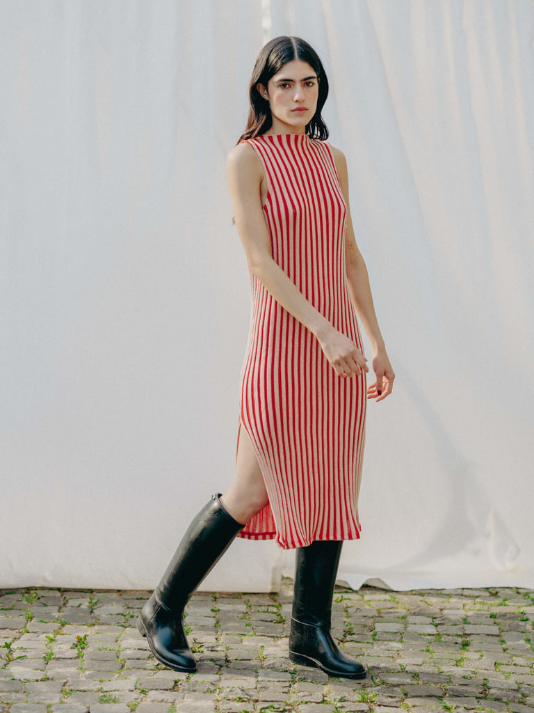 Swiss-made unique rib-knit cotton dress with pleated design, elegant high neckline, and chic side slits, perfect for evening wear or casual style, sustainable and made to order