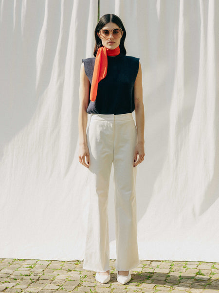 ASTRA: Flared legs, hook closure, handmade fringes. Sustainable, versatile, stylish. GOTS certified.