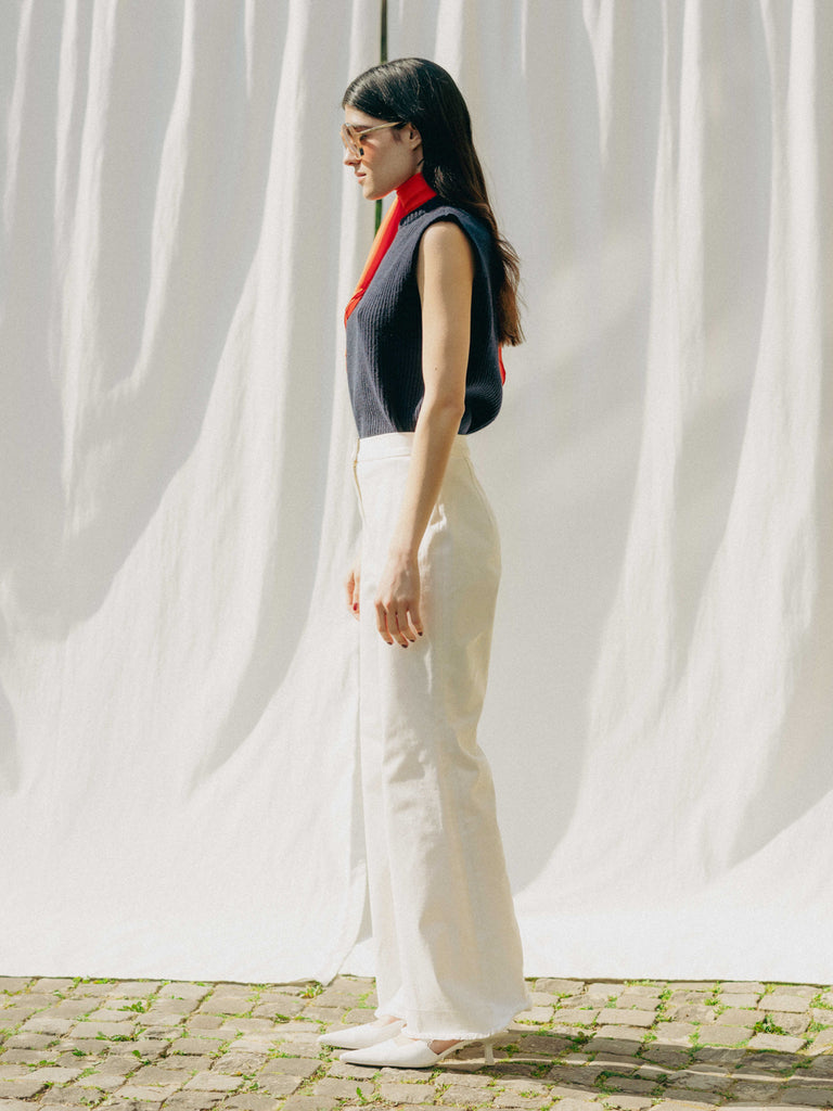 ASTRA: Flared legs, hook closure, handmade fringes. Sustainable, versatile, stylish. GOTS certified.