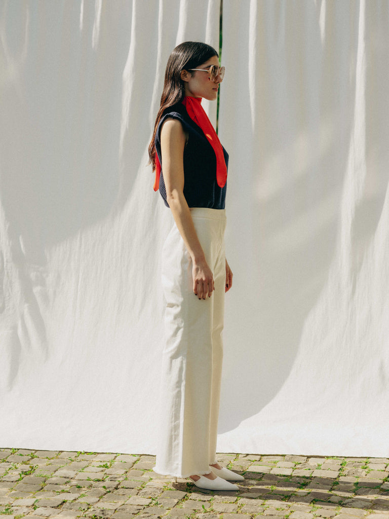 ASTRA: Flared legs, hook closure, handmade fringes. Sustainable, versatile, stylish. GOTS certified.