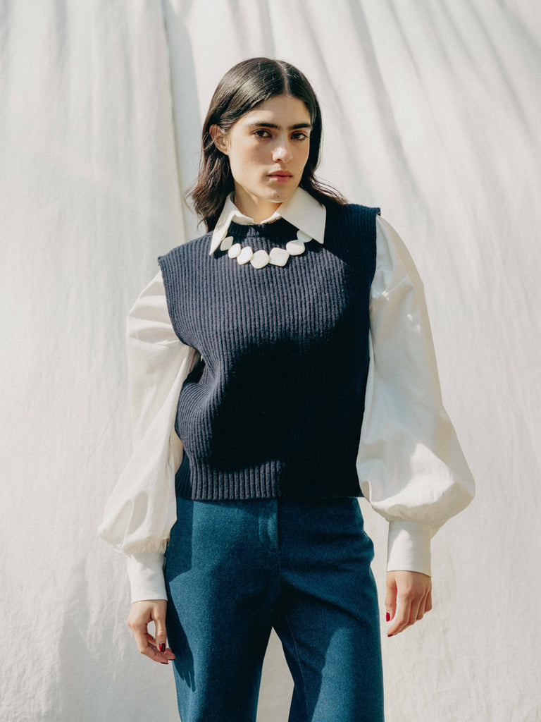 Indulge in luxury with our Navy Statement Piece, 100% recycled cashmere from Italy. Snug, fitted collar for timeless elegance