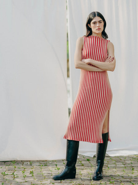 Swiss-made unique rib-knit cotton dress with pleated design, elegant high neckline, and chic side slits, perfect for evening wear or casual style, sustainable and made to order