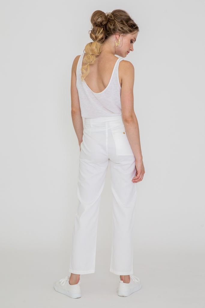 CHLOE is our Swiss-made Zurich-crafted gem, tailored from robust yet delicate organic cotton sateen. This trouser boasts a superb fit, allowing you to look effortlessly chic and elegant in its pristine white color. The CHLOE pants are versatile enough to suit both casual and formal occasions. You decide the style statement you want to make. Like many of our designs, these trousers are custom-tailored to your body measurements because we believe clothing should be as individual as every body shape.